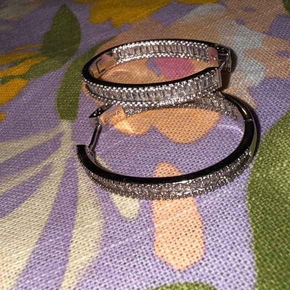 Elegant – These sparkling hoop earrings have a refined and sophisticated look. - Picture 9 of 14